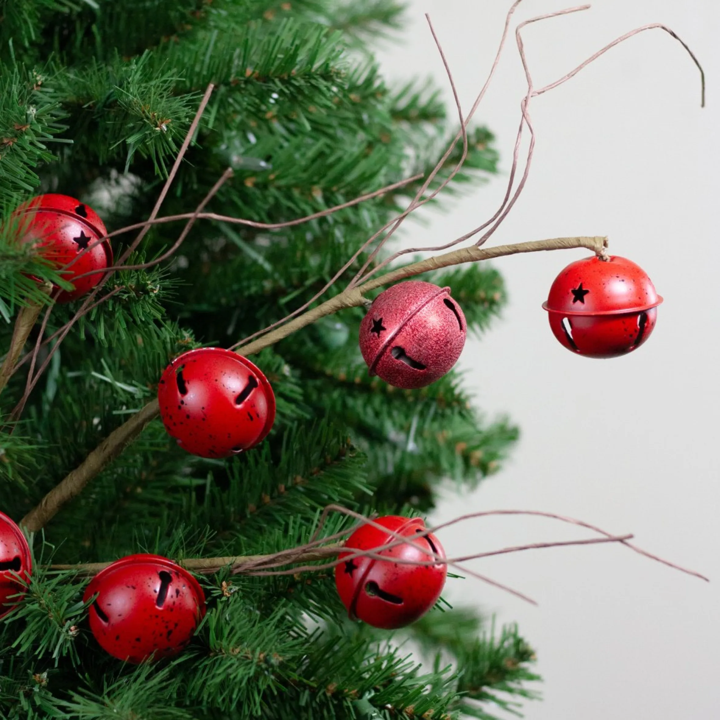 31" Brown And Red Jingle Bells With Star Cut-Outs Twig Artificial Christmas Spray